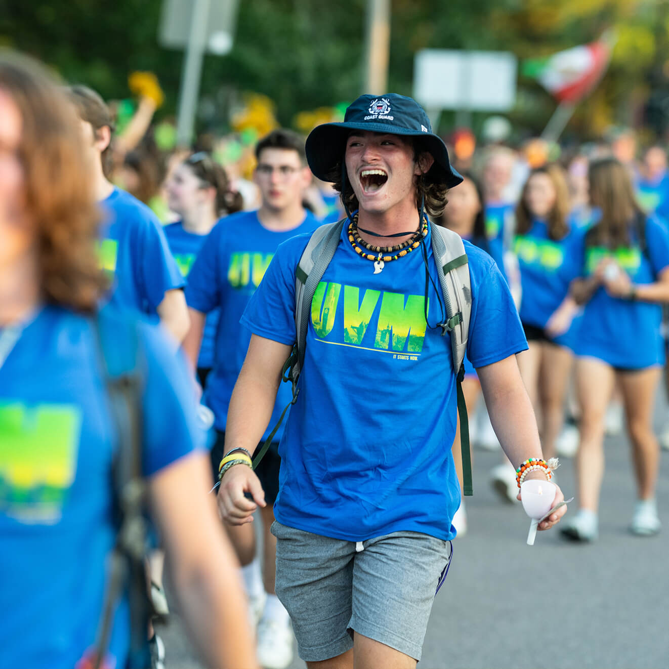 Students march across campus at convocation.